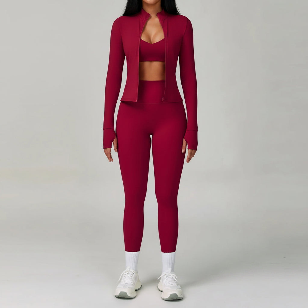 Person wearing a maroon athletic outfit on a plain background
