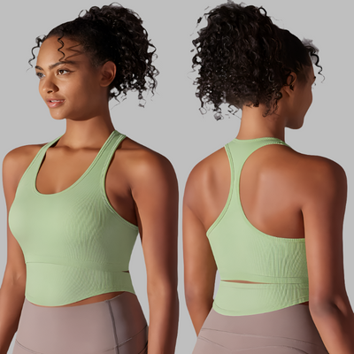 two images of the same women in a green ribbed tank, front and back view of racerback tank.