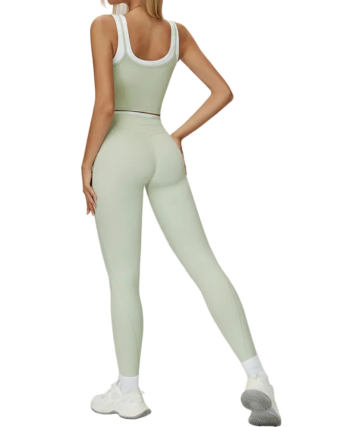 Person wearing a light green athletic outfit on a white background
