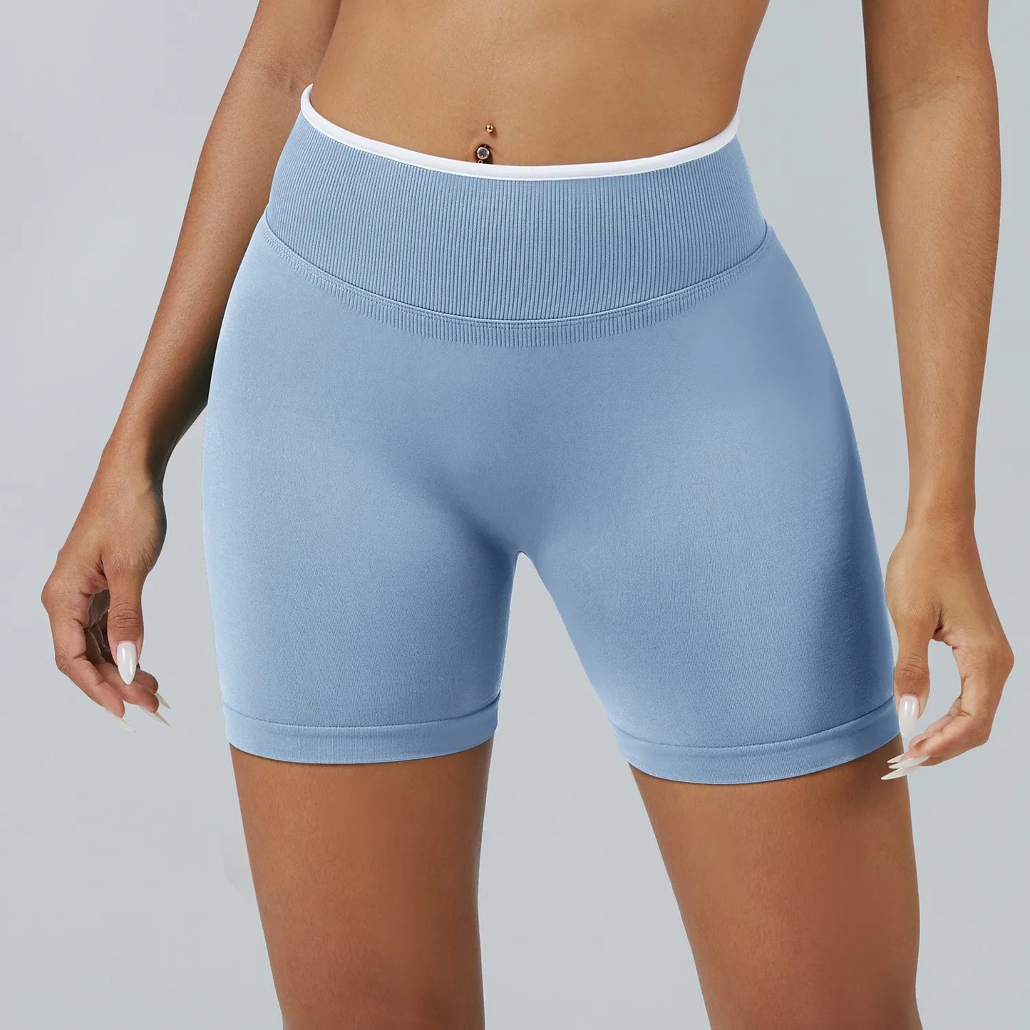 Light blue athletic shorts worn by a person on a gray background