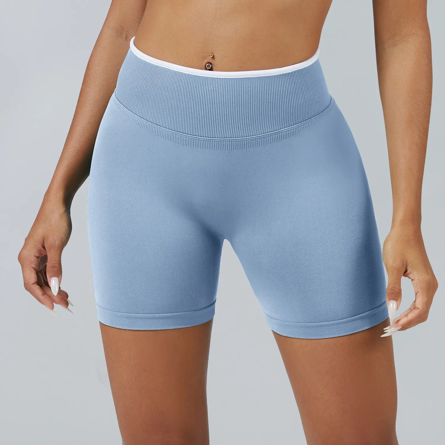 Light blue athletic shorts worn by a person on a gray background